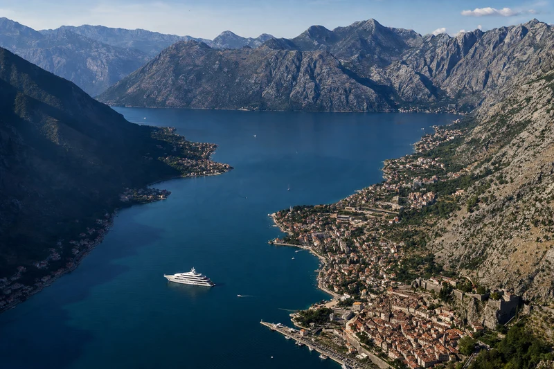 Aerial view of Bay of Kotor Montenegro with superyacht and medieval city